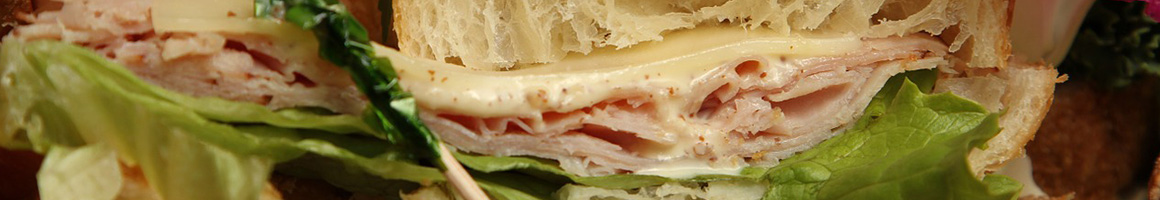 Eating Sandwich at Ipsento 606 restaurant in Chicago, IL.